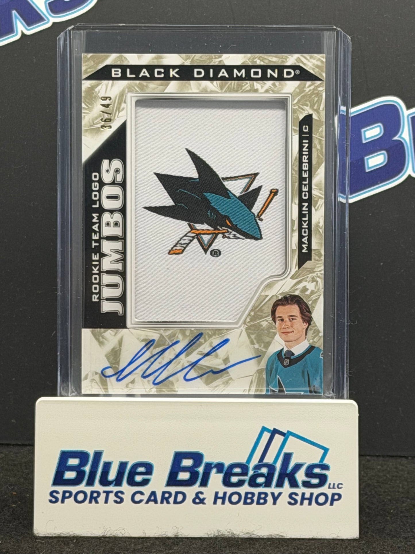 2024-25 Upper Deck -Black Diamond Hockey - Macklin Celebrini - Rookie Team Logo Jumbos - Autographed - 26/39 - San Jose Sharks - NHL