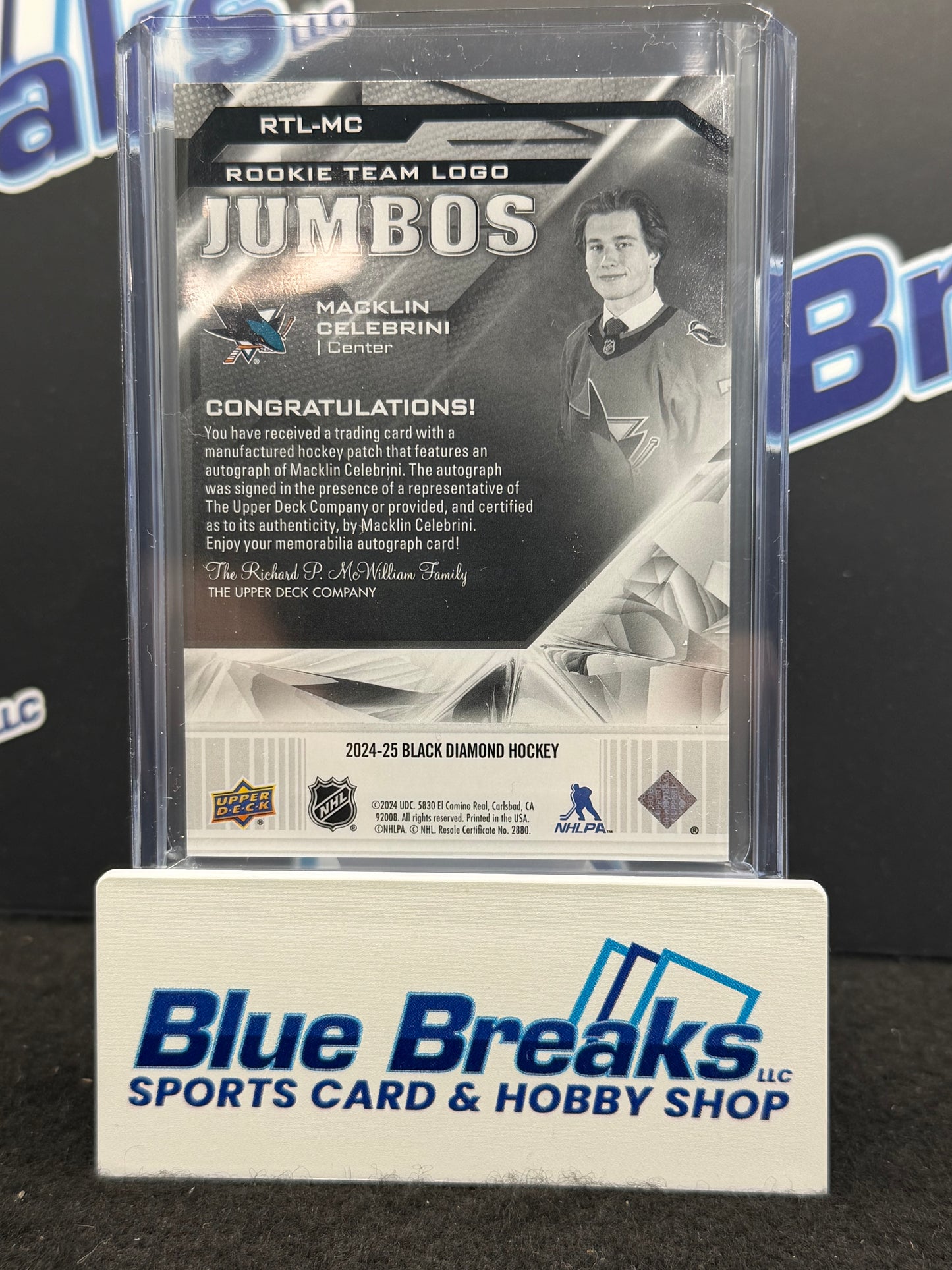 2024-25 Upper Deck -Black Diamond Hockey - Macklin Celebrini - Rookie Team Logo Jumbos - Autographed - 26/39 - San Jose Sharks - NHL