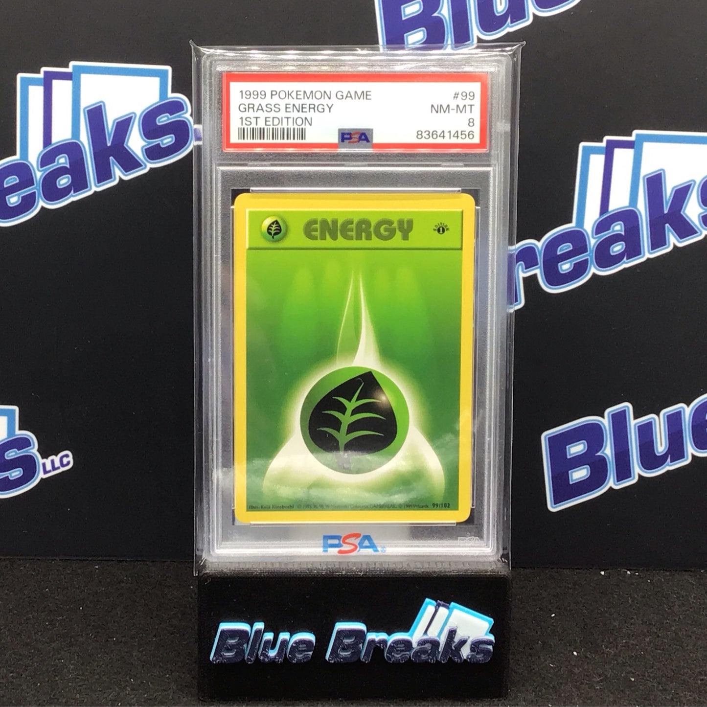 1999 Pokémon Game 1st Edition Grass Energy #99 PSA 8