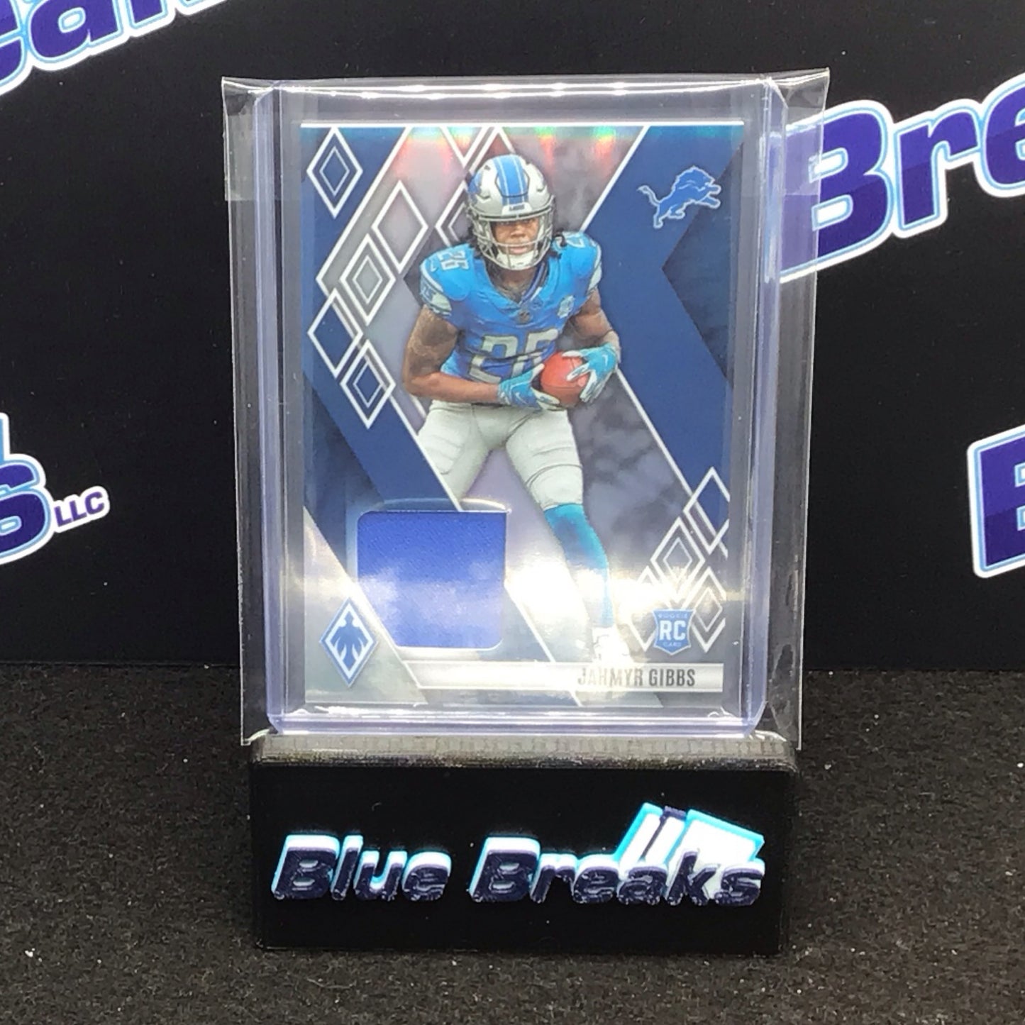 2023 Panini Phoenix Jahmyr Gibbs relic 115/299 RC #RME-JG Lions